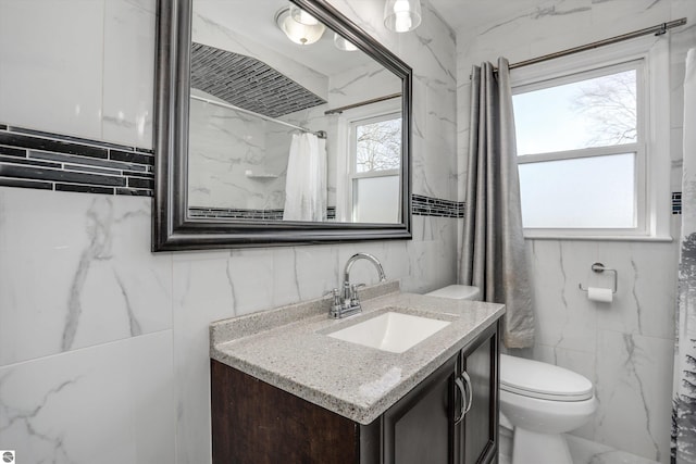 bathroom featuring vanity, a shower with shower curtain, tile walls, and toilet