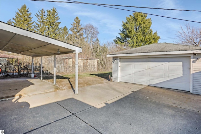 garage featuring a carport