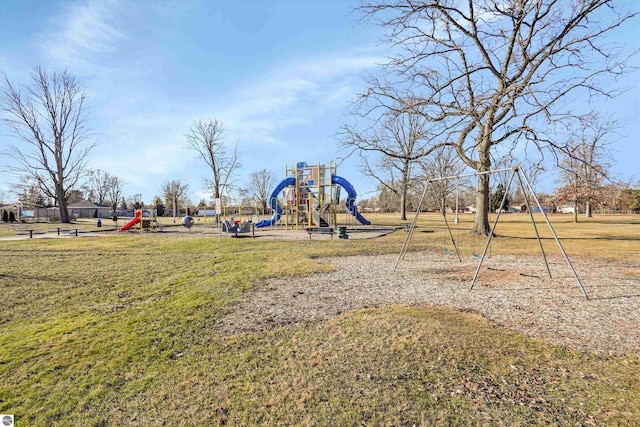 view of jungle gym with a lawn