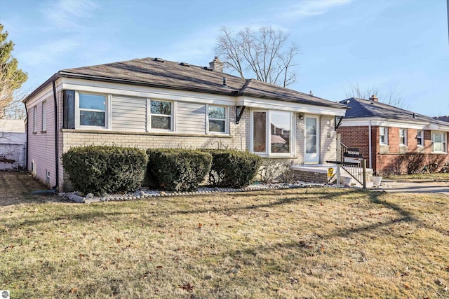 single story home with a front yard