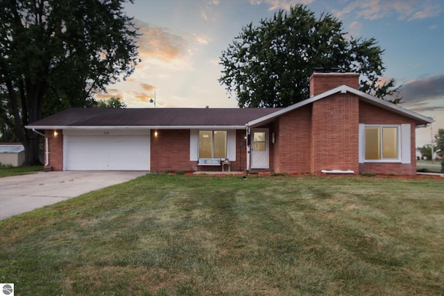 single story home with a yard and a garage