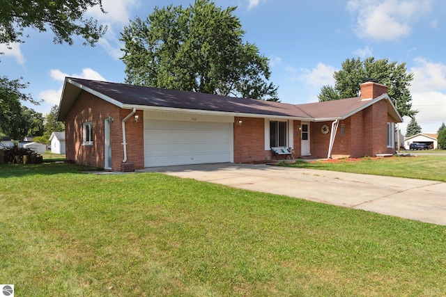 ranch-style home featuring a garage and a front lawn