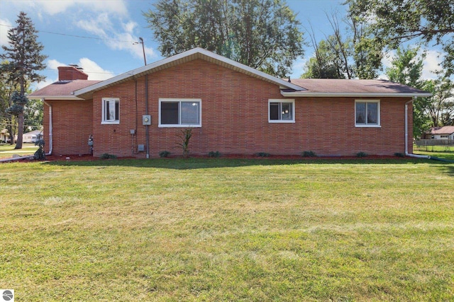 view of home's exterior featuring a yard