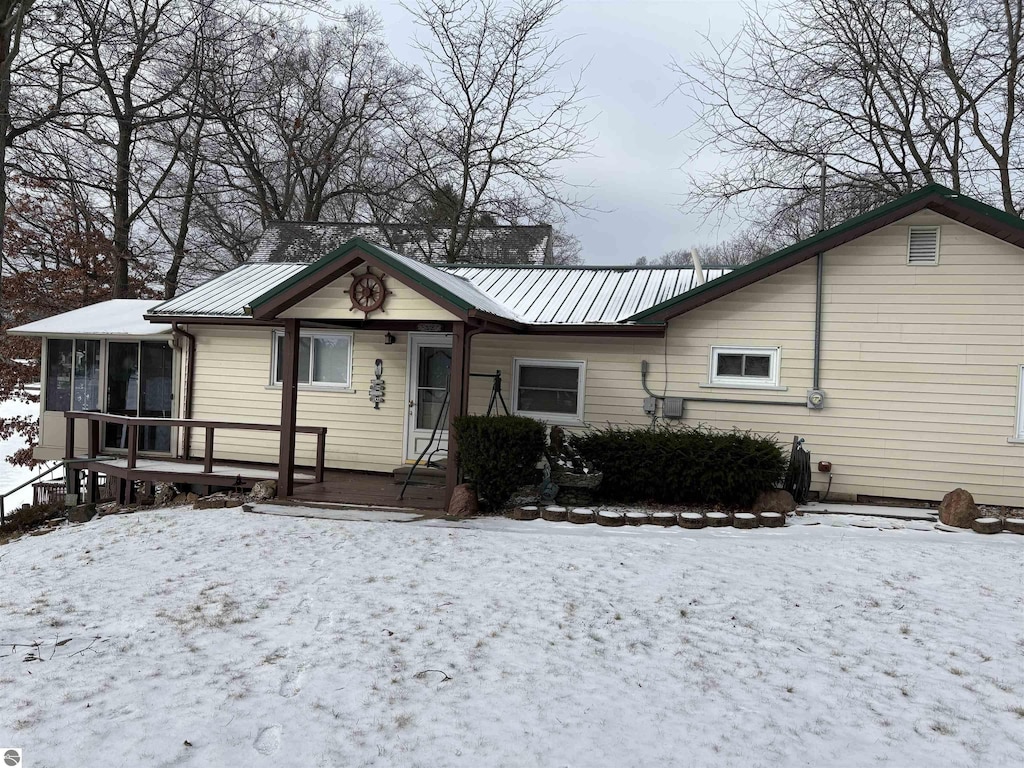 view of front of property with a sunroom