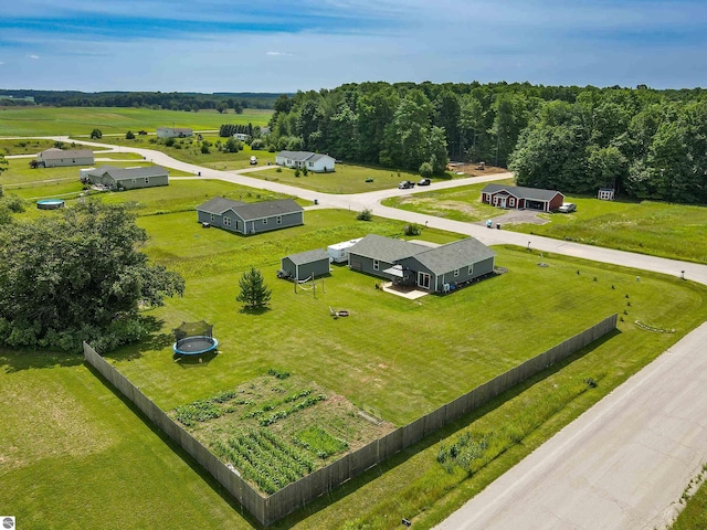 birds eye view of property with a rural view