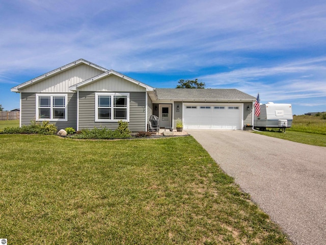 ranch-style home with a front lawn and a garage