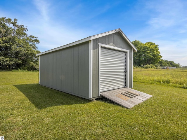 view of outbuilding with a lawn