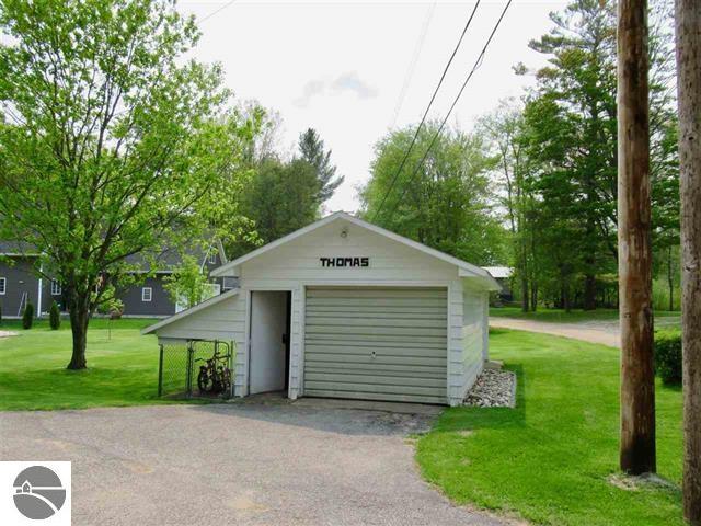 garage featuring a yard