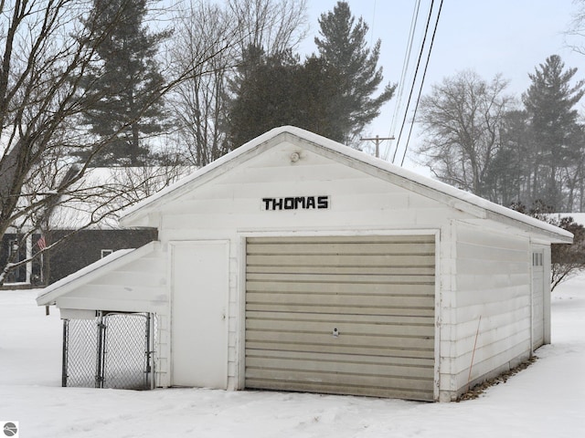 view of snow covered garage