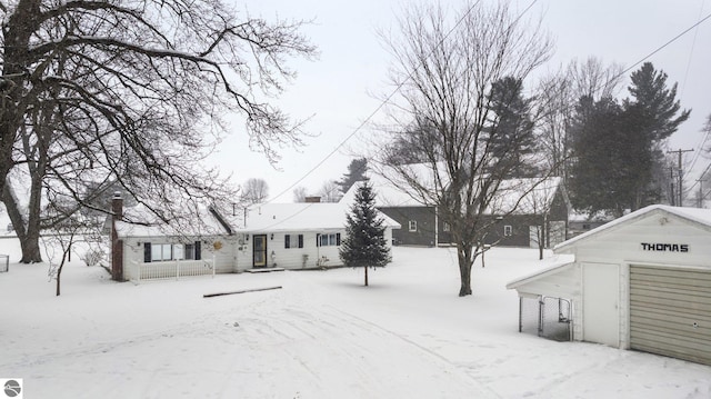 exterior space with an outbuilding and a garage