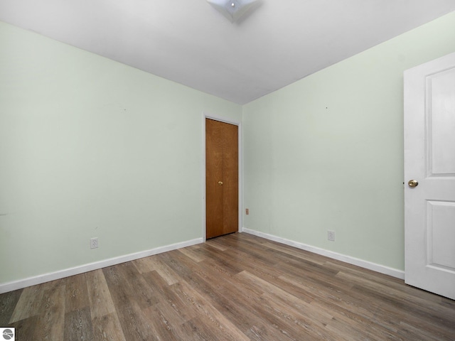 unfurnished room featuring hardwood / wood-style floors