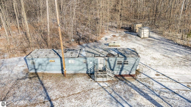 view of patio featuring a storage unit