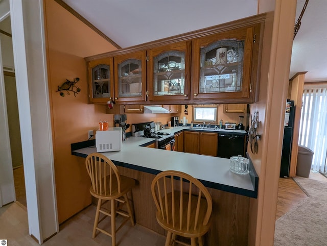 kitchen featuring kitchen peninsula, white appliances, plenty of natural light, and sink