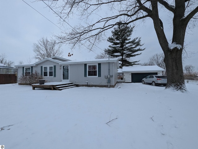 view of front of house with an outdoor structure and a garage