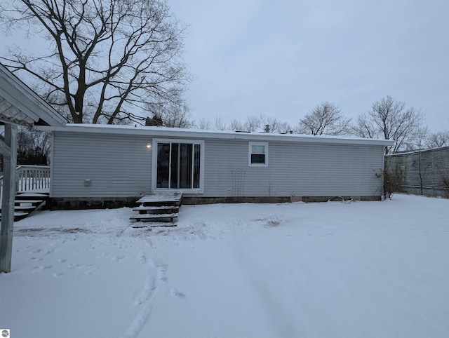 view of snow covered house