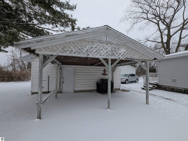 view of snow covered parking area