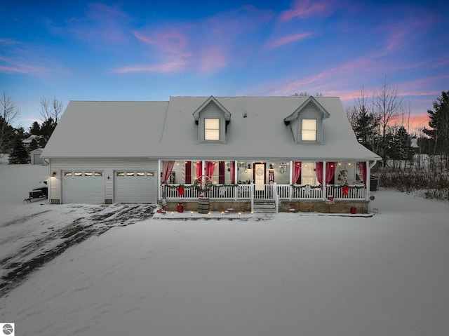 cape cod-style house with a garage