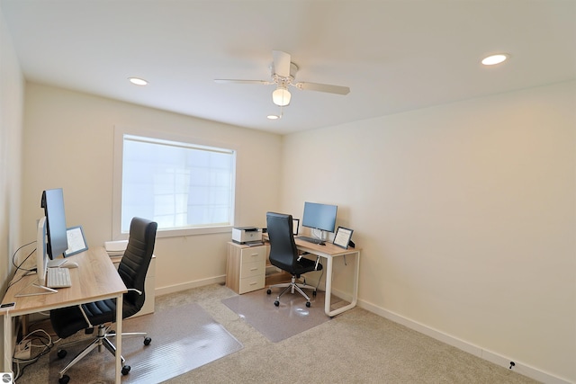 carpeted office with ceiling fan