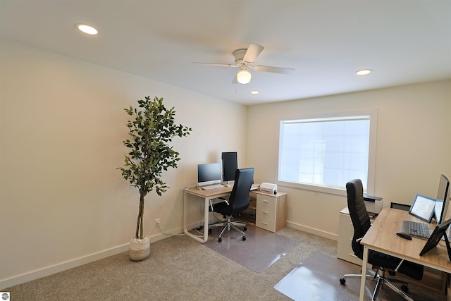 office featuring ceiling fan and light carpet