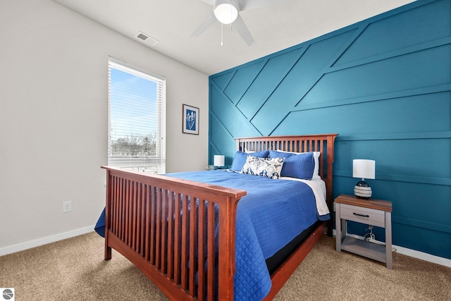 bedroom with ceiling fan and light colored carpet