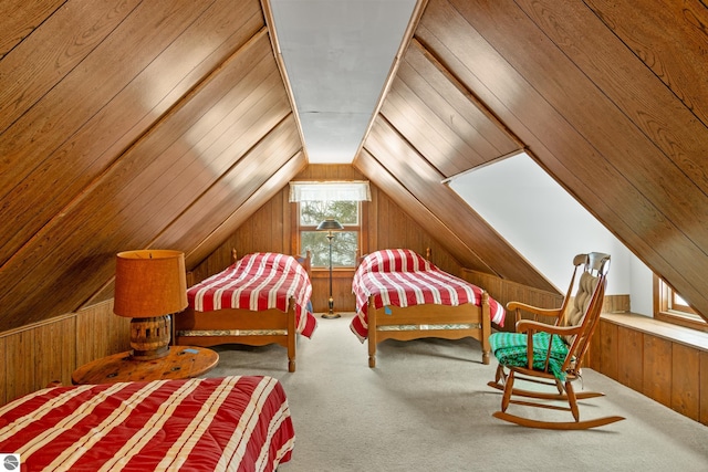 carpeted bedroom featuring lofted ceiling and wooden walls