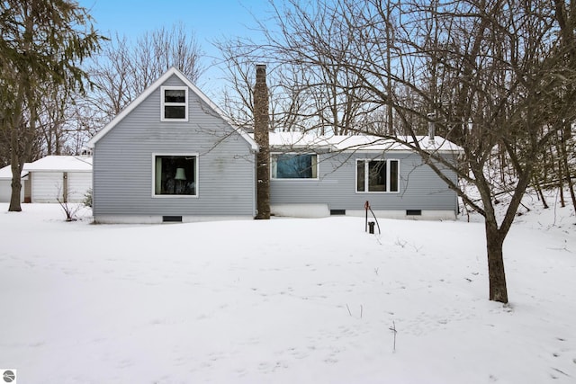 view of snow covered house