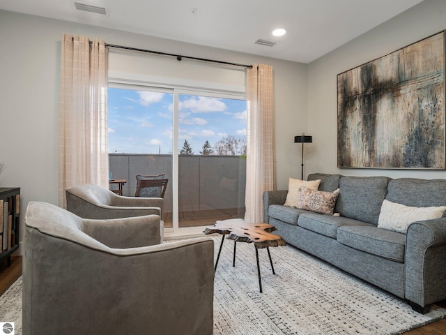 living room featuring plenty of natural light and hardwood / wood-style flooring