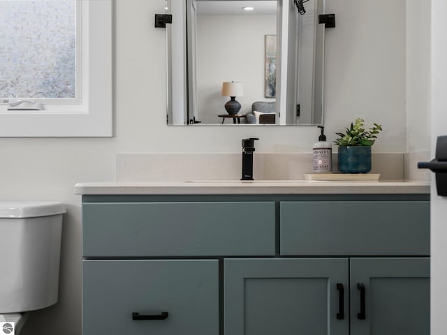 bathroom with vanity and toilet