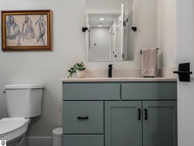 bathroom featuring vanity and toilet