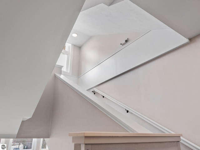 stairs featuring lofted ceiling