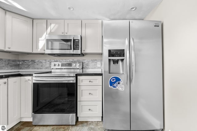 kitchen featuring white cabinets and appliances with stainless steel finishes