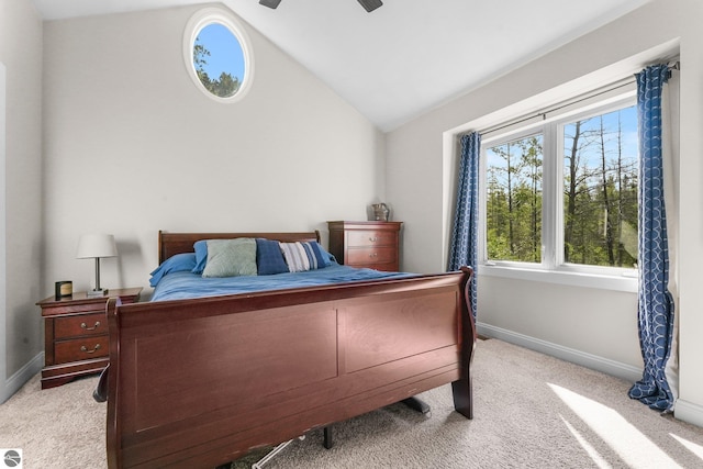 bedroom featuring ceiling fan, lofted ceiling, and light carpet