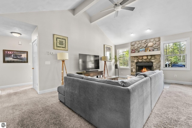 carpeted living room with ceiling fan, a fireplace, and lofted ceiling with beams