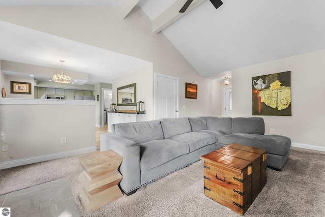 carpeted living room featuring vaulted ceiling with beams and ceiling fan with notable chandelier