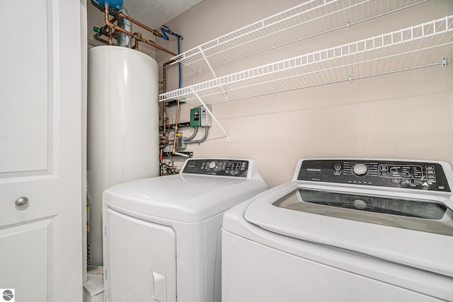 washroom with washing machine and dryer