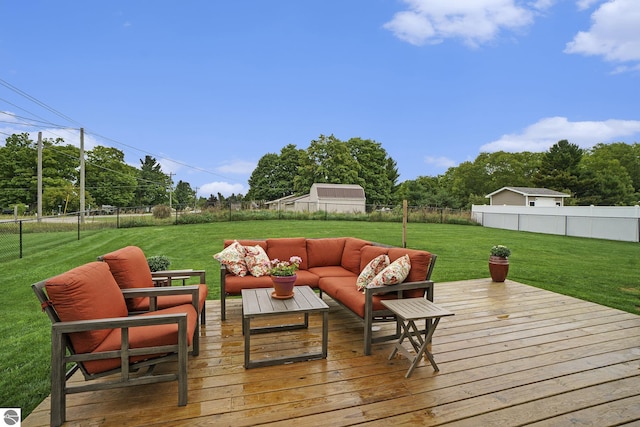 wooden terrace with a lawn and an outdoor hangout area