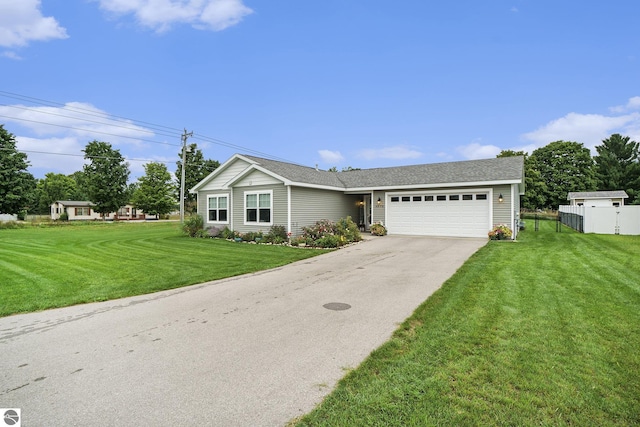 ranch-style home with a garage and a front yard