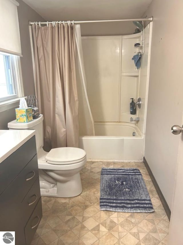 full bathroom featuring shower / tub combo with curtain, vanity, and toilet