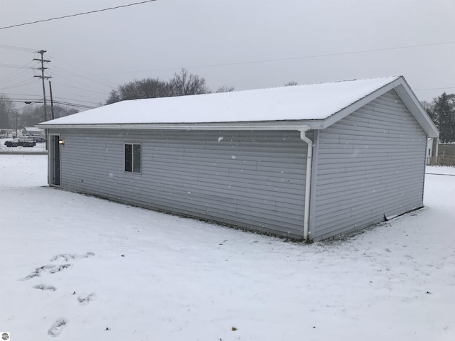 view of snow covered garage