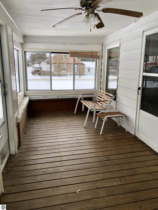 sunroom featuring plenty of natural light and ceiling fan