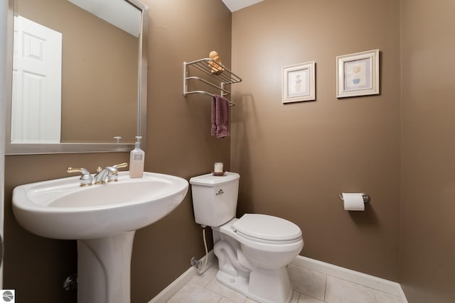 bathroom with tile patterned floors and toilet