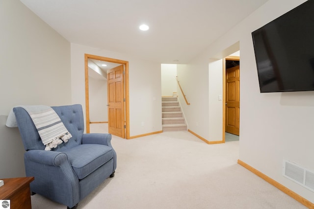 sitting room featuring carpet floors