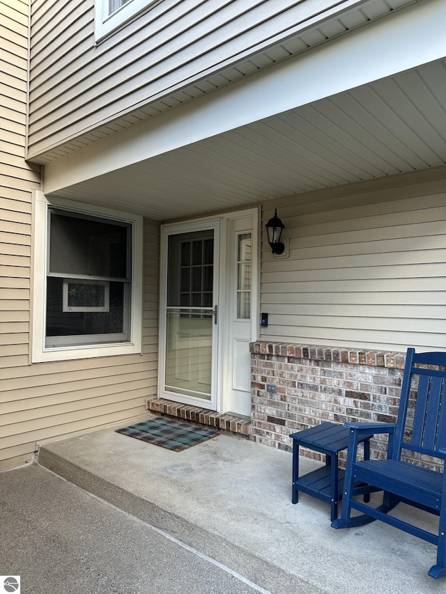 property entrance with a patio area