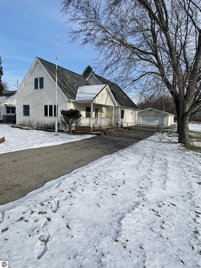 bungalow-style house with covered porch and a garage