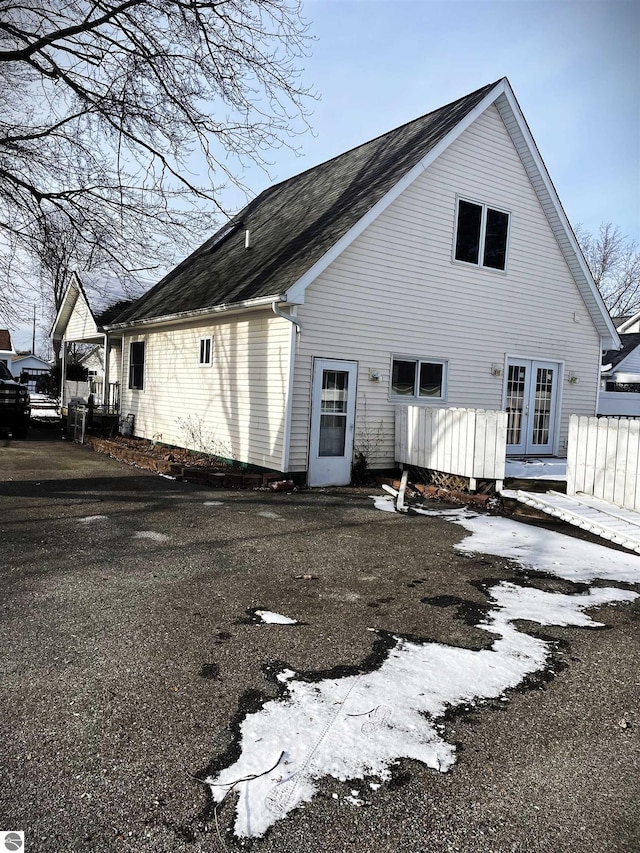 rear view of property featuring french doors