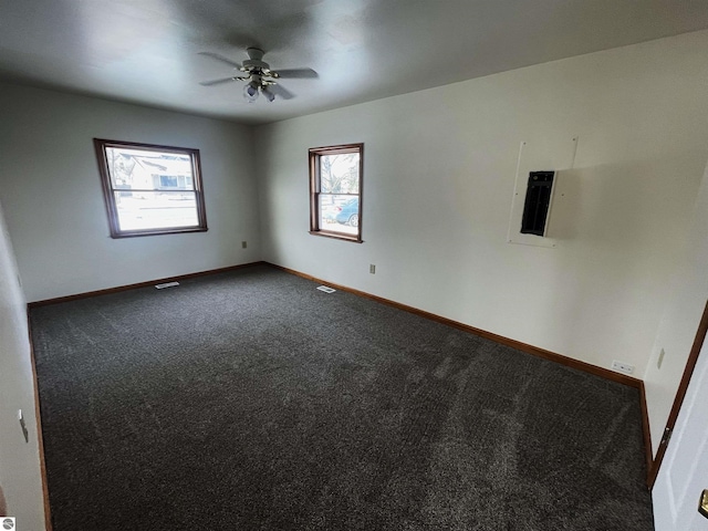 carpeted empty room with ceiling fan