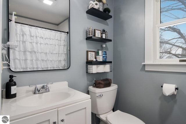 bathroom featuring vanity and toilet