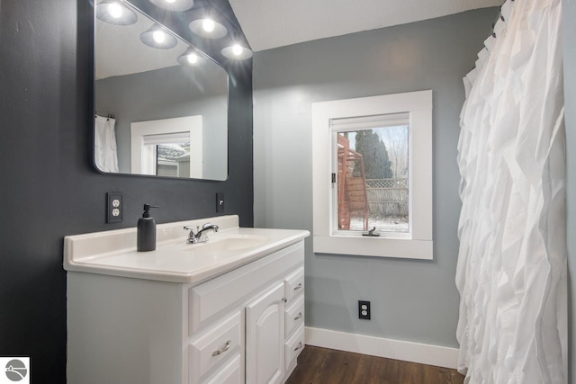 bathroom with hardwood / wood-style floors and vanity