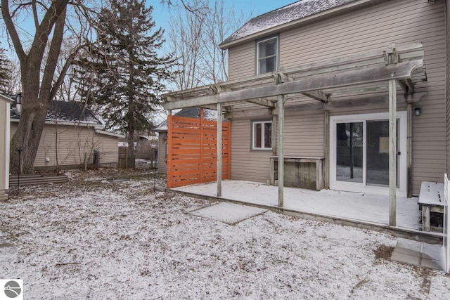 rear view of property with a pergola