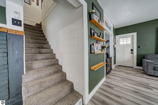 stairway featuring hardwood / wood-style floors